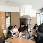 image of workers having an office meeting