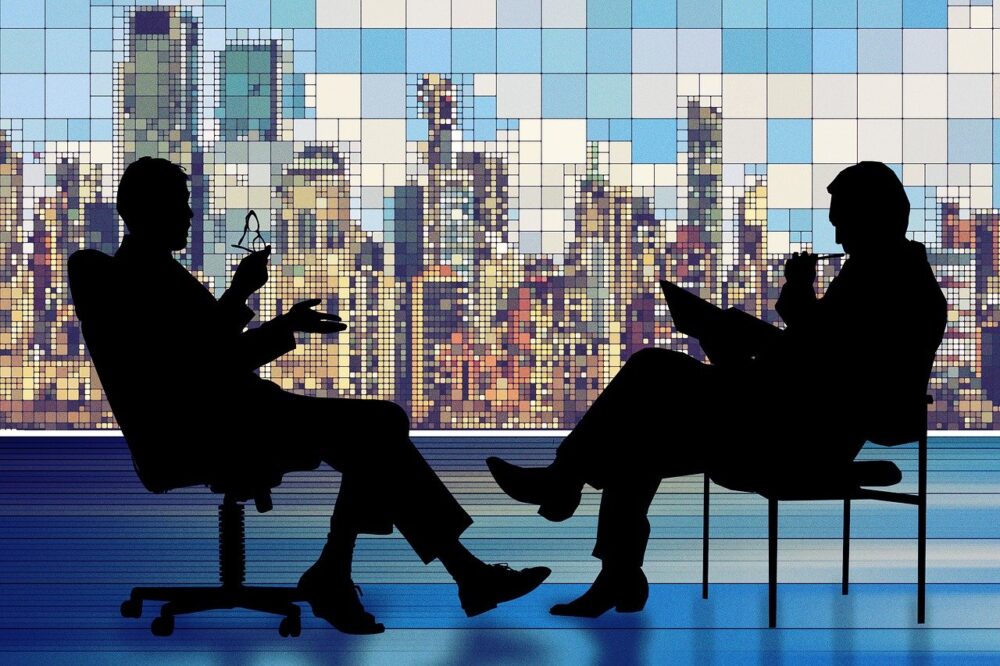 image showing two people discussing - rhinobay energy