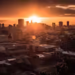 Image of sunset over a modern city - Rhinobay Energy