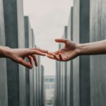 Image showing two outstretched hands touching - rhinobay energy