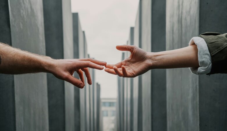 Image showing two outstretched hands touching - rhinobay energy